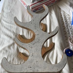 Wine bottle holder or use it in the bathroom with rolled up towels